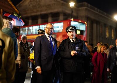 British Home Secretary James Cleverly with police Deputy Assistant Commissioner Laurence Taylor visit anti-terrorism operation Project Servator in action in Trafalgar Square, London, on December 19. PA