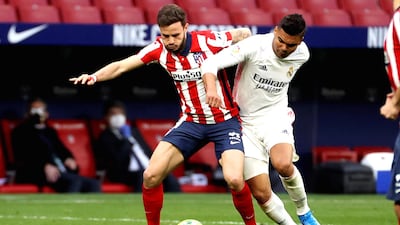 Atletico Madrid's Saul Niguez in action against Real Madrid's Casemiro. EPA