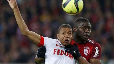 Lille's Adama Soumaoro and Monaco's Kylian Mbappe Lottin in action during their Ligue 1 match on Sunday. Pascal Rossignol / Reuters / April 10, 2016