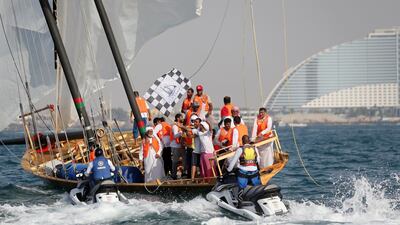 Emirati team celebrate their winning of the 29th annual dhow sailing race, known as The Gaffal, at the finish line in Dubai. AFP