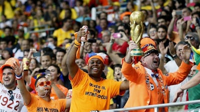 Netherlands fans celebrate at the Arena Fonte Nova in Salvador, Brazil on Friday night during the 5-1 victory over Spain in World Cup Group B play. Juanjo Martin / EPA
