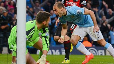 Manchester City defender Pablo Zabaleta celebrates after scoring his team's opening goal against West Brom on Monday night. Andrew Yates / AFP / April 21, 2014