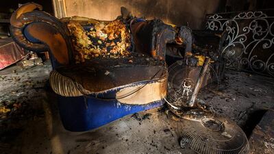 Witnesses reported seeing a plume of smoke and then flames from the villa. Fire-fighting teams from Al Rashidya station arrived within minutes and quickly brought the blaze under control. Victor Besa for The National