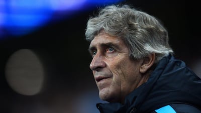 Manchester City manager Manuel Pellegrini observes his side during their Champions League match on Tuesday at the Etihad Stadium. Laurence Griffiths / Getty Images