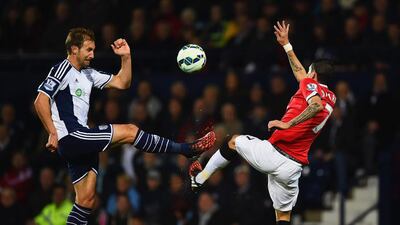Angel di Maria of Manchester United battles with Craig Dawson of West Bromwich Albion for the ball during their Premier League match on Tuesday at The Hawthorns. Laurence Griffiths / Getty Images