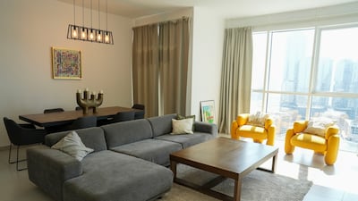 The spacious living and dining areas of the three-bedroom home