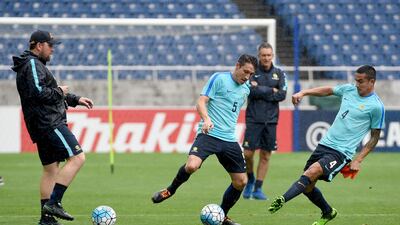 Mark Milligan, centre, and Tim Cahill, right, will be part of the Australia squad aiming to secue a place at the 2018 World Cup. Toru Yamanaka / AFP