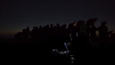 A handout image provided by the World Press Photo (WPP) organisation on 18 February 2016 shows a picture by Swedish photographer Paul Hansen for Dagens Nyheter that won 2nd prize singles in the General News category of the 59th annual World Press Photo Contest, it was announced by the WPP Foundation in Amsterdam, The Netherlands on 18 February 2016. The picture shows refugees travelling in darkness through Europe to avoid detection; Lesbos, Greece, 06 December 2015. Paul Hansen / EPA