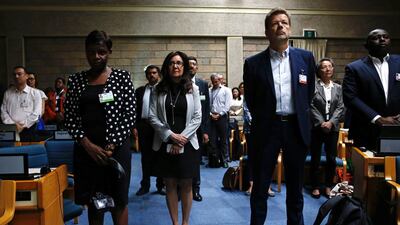 Delegates observe a minute of silence at the United Nations Environment Assembly in Nairobi. Reuters