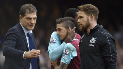 Manuel Lanzini comes off injured during West Ham's Premier League match against Liverpool. Toby Melville / Reuters