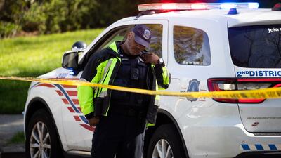 Washington local police stand beside a police tape near the Peruvian Embassy. EPA
