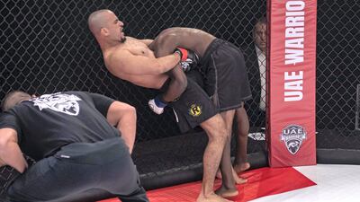 Emirati Ahmed Al Darmaki has Ugandan Kagimu Kigga in a standing guillotine choke position. Courtesy UAE Warriors