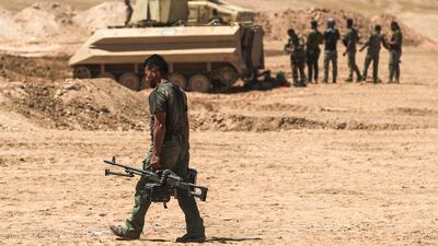 Iraqi pro-government forces advance towards the Unesco-listed ancient city of Hatra, south-west of Mosul, during an offensive to retake the area from ISIS fighters, on April 26, 2017.
