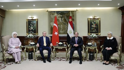 Mr El Sisi, centre right, his wife Entissar Amer, right, and Mr Erdogan, centre left, and his wife Emine Erdogan, left, during their meeting in Cairo. EPA