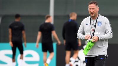 England's assistant coach Steve Holland attends a training session at Spartak Zelenogorsk Stadium in Saint Petersburg. Holland apologised to the squad after images were released of him holding what appeared to show England's team to face Panama. Paul Ellis / AFP