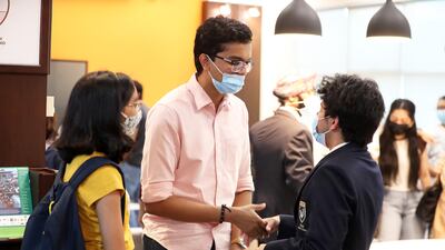 Pupils congratulate each other after receiving their IB results at Gems Modern Academy.