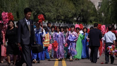 Participants and spectators leave following a mass rally on Kim Il Sung square in Pyongyang. AFP