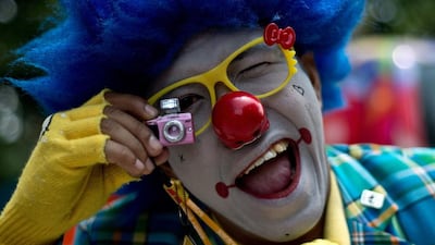 The donning of a mask – any mask – affords a degree of anonymity, and anonymity can often bring out the worst in us. Manan Vatsayana / AFP