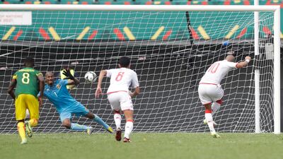 Mali's goalkeeper Ibrahima Mounkoro saves Wahbi Khazri's penalty. AP