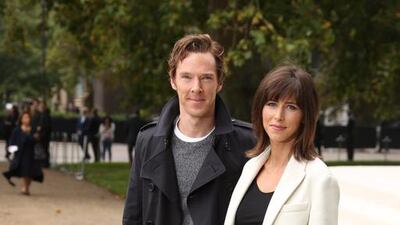 British actor Benedict Cumberbatch and wife Sophie Hunter poses for photographs as they arrive for the Burberry Prorsum Womenswear Spring and Summer show in London. Joel Ryan / Invision / AP
