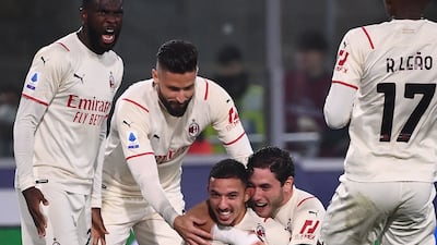 AC Milan's Ismael Bennacer celebrates with Olivier Giroud, Davide Calabria and Rafael Leao. AFP