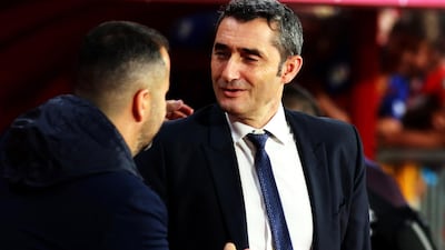 Granada's head coach Diego Martinez greets Barcelona's head coach Ernesto Valverde. EPA