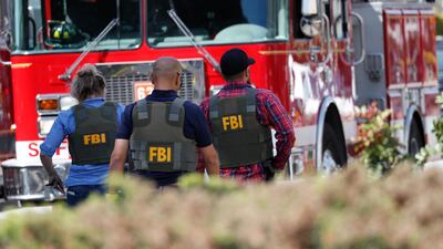 FBI agents arrive on the scene of the shooting. They will attempt to piece together the reason's behind the shooter's actions, which remain unexplained. EPA/JOHN G. MABANGLO