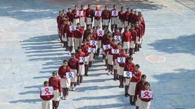 Pupils pose with placards to raise awareness on World Aids Day, in India's north-western city of Amritsar. AFP