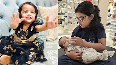 Sadia Begum, 2, left, survived with a fractured leg in a road accident that killed her parents in Abu Dhabi. Sidra Begum, 7, with her brother Syed. He is in intensive care with head injuries. Photo: Syed Ismail