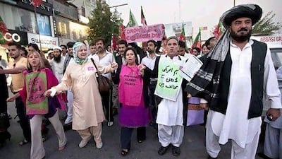 Peace activists from the US and supporters of Pakistan Tehreek-e-Insaf protest against the drone attacks in the Pakistani tribal region at Islamabad on Saturday.