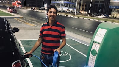 Ayman Mohamed, founder of the Electrified consumer platform, charges his fully electric Fiat 500e at a station in Cairo’s Nasr City. Photo: Ayman Mohamed