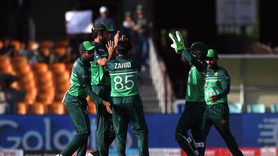 Pakistani players celebrate after taking the wicket of Australia's Travis Head. EPA