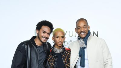 Trey Smith, Jaden Smith and Will Smith, in a scarf and cream bomber, visit a Louis Vuitton boutique as part of Paris Fashion Week on October 2, 2017 in Paris, France. Getty Images