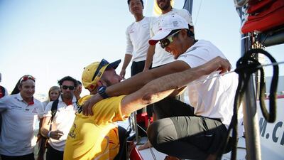 British skipper Ian Walke, left, of Abu Dhabi Ocean Racing congratulates Jin Hao Chen, right, of Dongfeng Race Team, who arrived second after ADOR on Wednesday by just 12 minutes. Nic Bothma / EPA