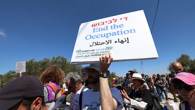 Anti-settler protestors in the village of Qusra, near Nablus. Britain could soon sanction illegal settlements and their businesses. EPA
