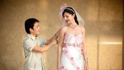 Angelina Stojsavljevic wears a bridal dress by the designer Edwin De Jesus (pictured) at the Bride Show Dubai.