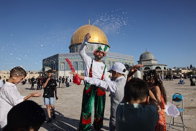 Celebrations in front of the Dome of the Rock mosque after the morning Eid Al Fitr prayer, which marks the end of Ramadan, at Al Aqsa Mosque compound, May 13, 2021. AFP