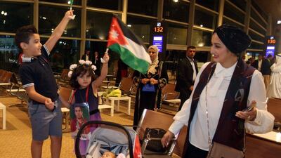 Fans at the arrival of Ahmed Abughaush. Khalil Mazraawi / AFP