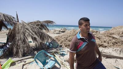 Abdul Rahman Qannan at the beach-front cafe where his cousin Mohammed was killed overnight while watching the World Cup match between Argentina and The Netherlands on Wednesday night. Heidi Levine for The National