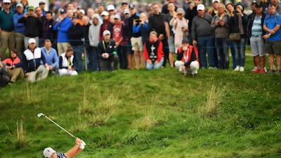 American Patrick Reed plays a shot. Getty Images