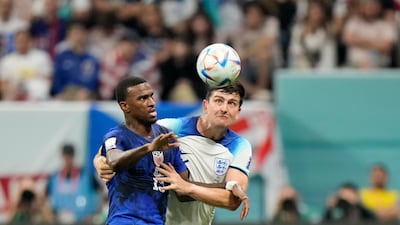 England's Harry Maguire, right, vies for the ball with Haji Wright of the United States during the World Cup group B soccer match between England and The United States, at the Al Bayt Stadium in Al Khor , Qatar, Friday, Nov. 25, 2022. (AP Photo / Luca Bruno)