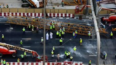 A crane working on the Dubai Metro track, near Emirates Tower fell onto scaffolding causing parts of Sheikh Zayed Road to be closed.