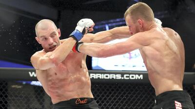 Dan Moret (black gloves) fights Anton Kuivanen in the lightweight division during the UAE Warriors event at the Mubadala Arena, Abu Dhabi. Chris Whiteoak / The National