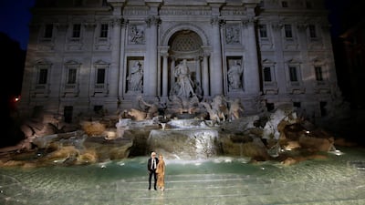 To celebrate the 90th birthday of Fendi, Lagerfeld staged a fashion show on Rome's Trevi Fountain, covering it with glass. The effect was that models, and here Karl Lagerfeld and Silvia Fendi, seemed to walk on water. Reuters, Max Rossi