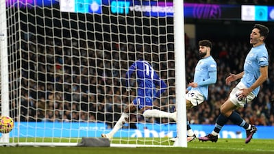 Manchester City's Abduqodir Khusanov, right, after gifting Chelsea's Noni Madueke a goal. PA