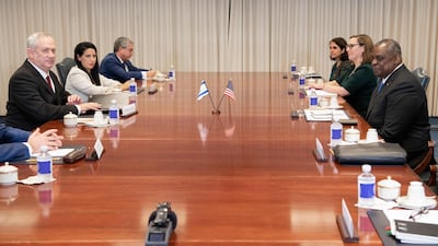 Mr Austin holds talks with the Israeli delegation led by Mr Gantz. AFP