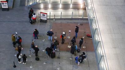 Travellers stand in line for Covid-19 tests after arriving at Heathrow Airport in London. Bloomberg