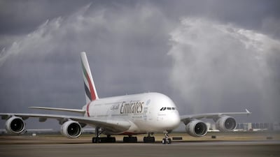 An Emirates Airbus A380 is showered by water canons on airport emergency vehicles as it makes it's inaugural arrival at Dallas-Fort Worth International Airport. AP Photo