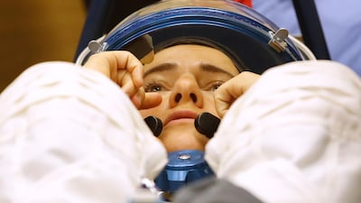 US astronaut Jessica Meir has her space suit inspected ahead of the launch. Dmitri Lovetsky / AP