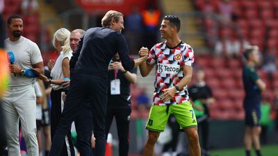 Cristiano Ronaldo shakes hands with Peter Crouch. Reuters